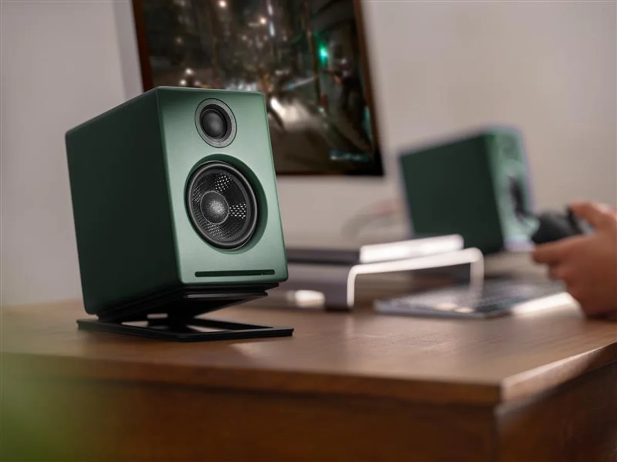 Matte-green Audioengine A2+ Next Gen speakers in the manufacturer's desktop setup