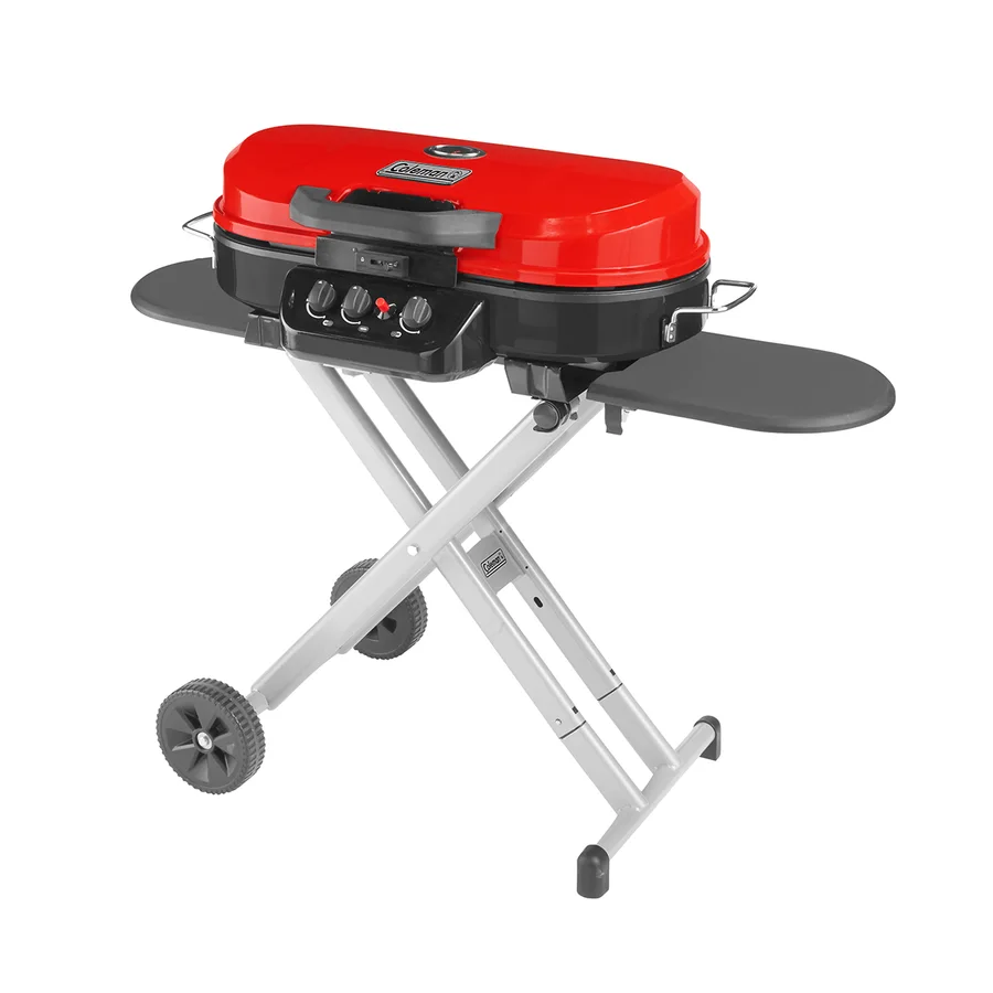 Coleman RoadTrip 285 red portable propane grill on its folding wheeled stand
