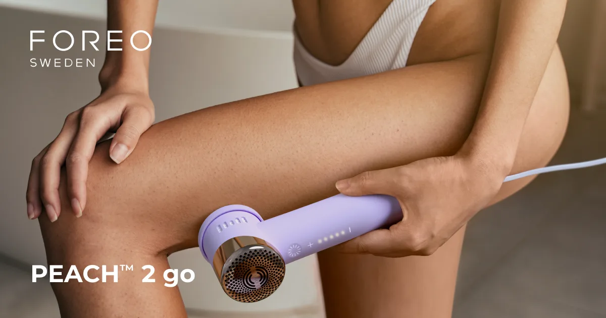 FOREO PEACH 2 go device being held against a leg in a manufacturer photo