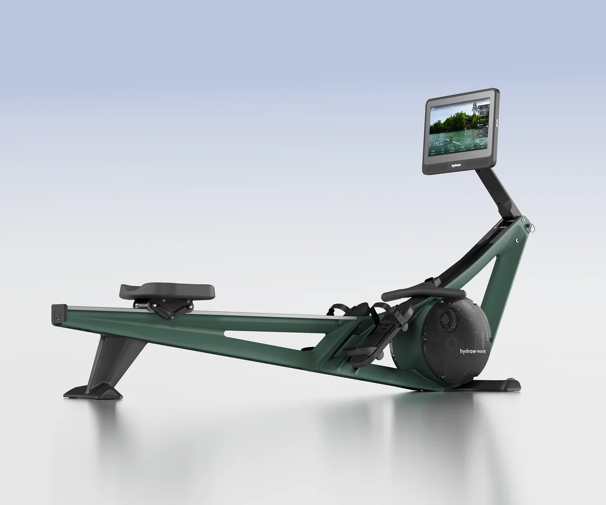 Hydrow Wave rowing machine in Forest green with its 16-inch touchscreen and full rail